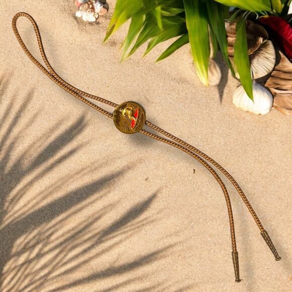 Vintage Hawaiian Bolo Tie Mens Coastal Cowboy Brass 3D Medallion Fabric Chord - Picture 1 of 7